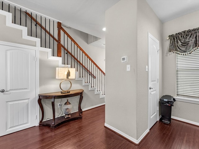 entryway with dark hardwood / wood-style floors