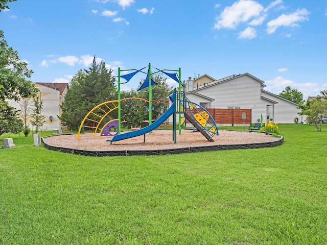 view of jungle gym featuring a lawn