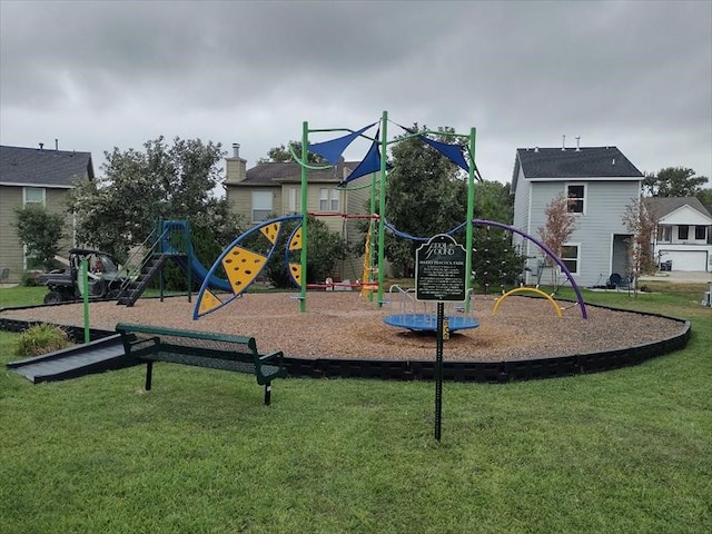 view of playground with a lawn