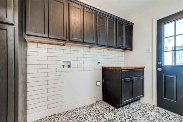 clothes washing area featuring cabinets, washer hookup, electric dryer hookup, and ornamental molding