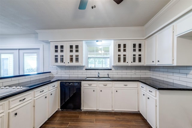 kitchen with dishwasher, white cabinetry, sink, and tasteful backsplash