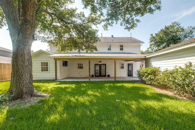 rear view of house with a patio area and a yard