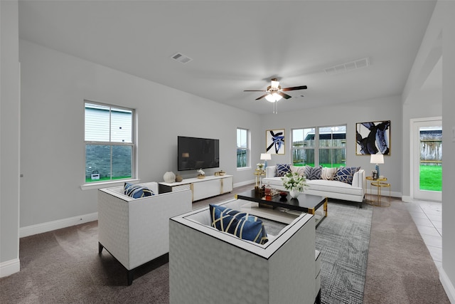 carpeted living room featuring ceiling fan