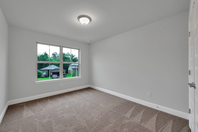 unfurnished room featuring carpet