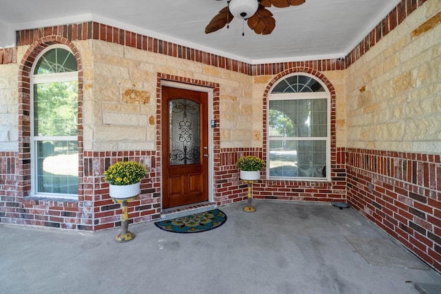 entrance to property featuring ceiling fan