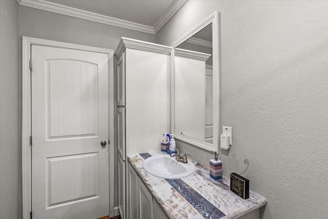 bathroom with vanity and ornamental molding