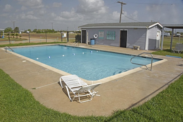 view of swimming pool with a patio