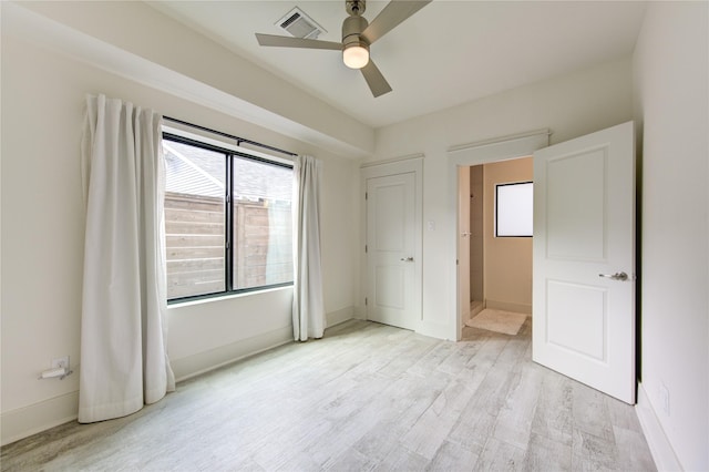 unfurnished bedroom featuring ceiling fan and light hardwood / wood-style flooring