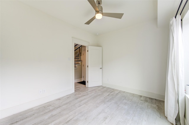 unfurnished room featuring ceiling fan and light hardwood / wood-style floors