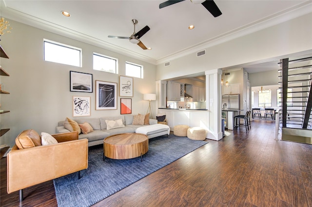 living room with ceiling fan, crown molding, and dark hardwood / wood-style flooring