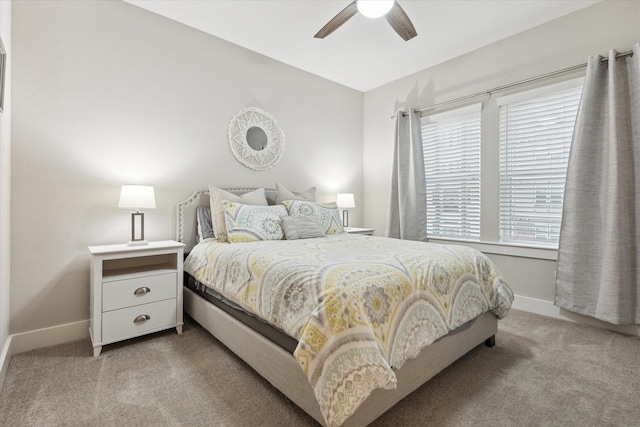 bedroom with ceiling fan and light carpet