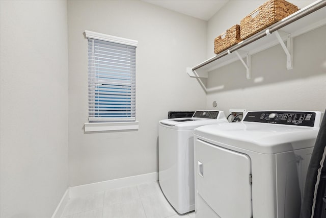 laundry room featuring washing machine and clothes dryer