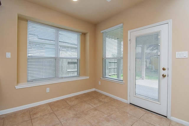 entryway featuring light tile patterned flooring