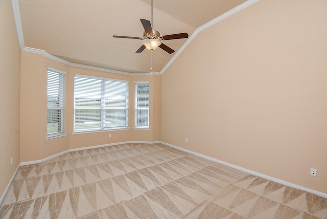 empty room featuring crown molding, ceiling fan, light colored carpet, and lofted ceiling