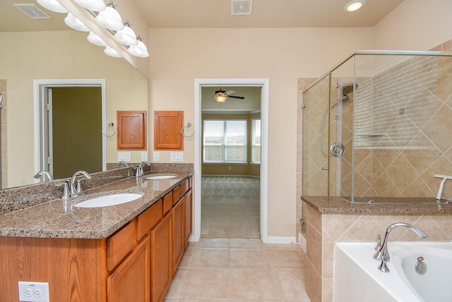 bathroom with tile patterned floors, ceiling fan, separate shower and tub, and vanity