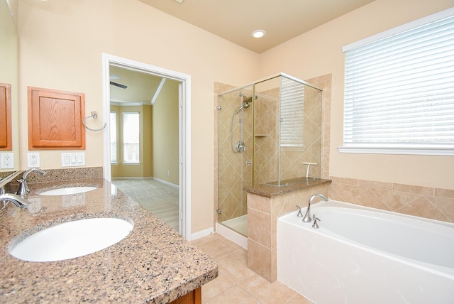 bathroom with vanity, tile patterned floors, independent shower and bath, and crown molding