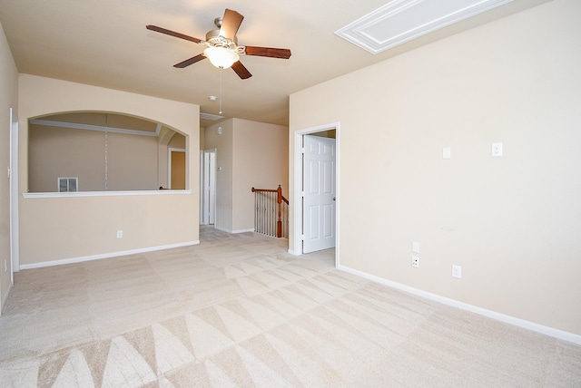 carpeted empty room with ceiling fan