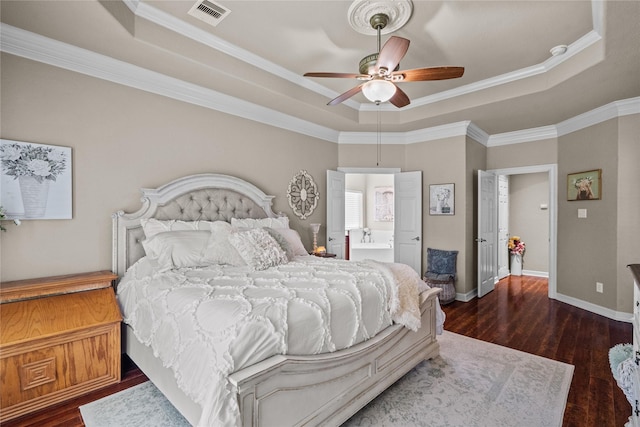 bedroom featuring ceiling fan, dark hardwood / wood-style floors, a raised ceiling, and ornamental molding