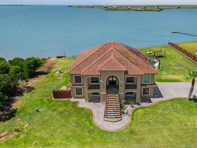 view of front of house featuring a water view and a front lawn