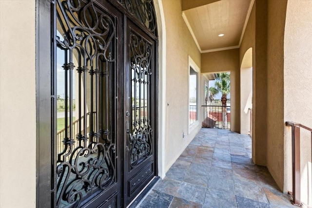 view of exterior entry featuring french doors