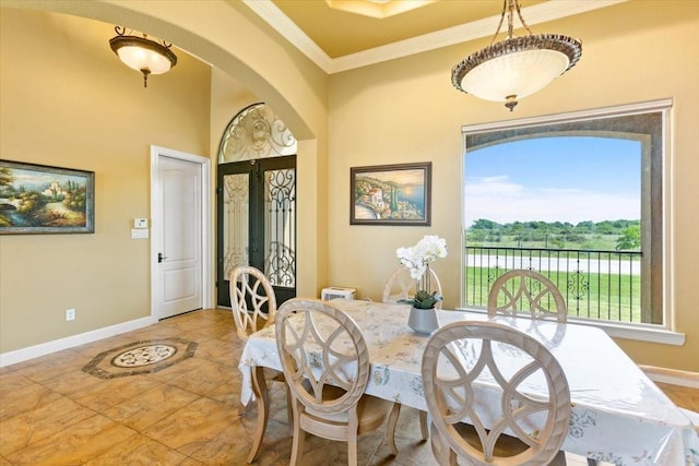 dining room featuring crown molding and french doors