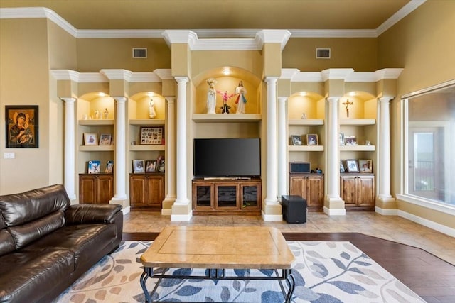 living room featuring hardwood / wood-style floors, built in shelves, and ornamental molding