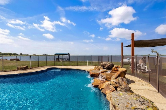 view of pool featuring pool water feature and a water view