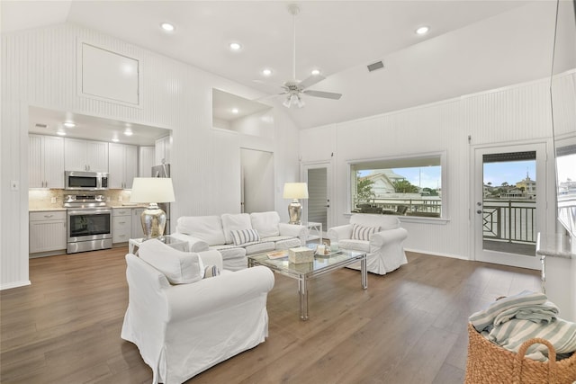 living room featuring wood-type flooring, high vaulted ceiling, and ceiling fan