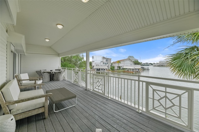 wooden deck featuring a water view