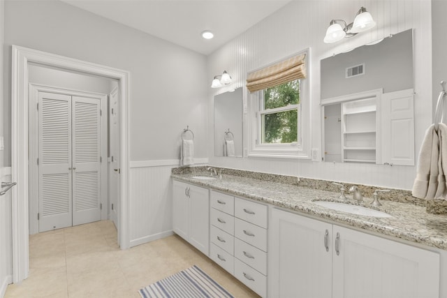 bathroom with tile patterned floors and vanity