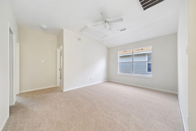 carpeted empty room featuring ceiling fan