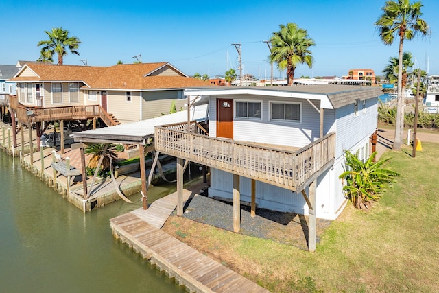 back of property featuring a deck with water view