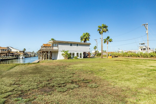 view of yard featuring a deck with water view