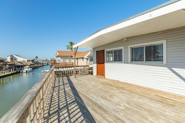 wooden deck with a water view