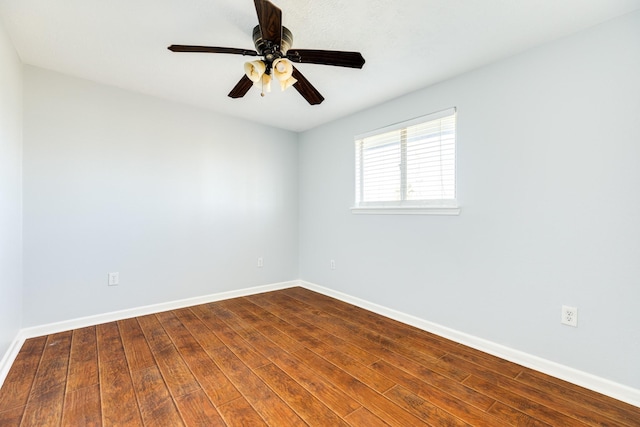 empty room featuring hardwood / wood-style floors and ceiling fan