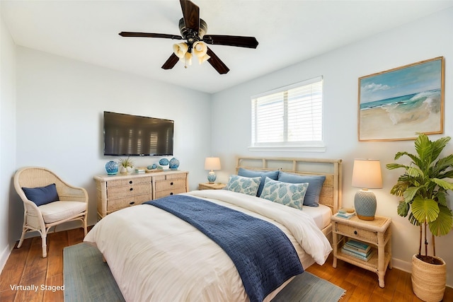 bedroom featuring ceiling fan and dark wood-type flooring