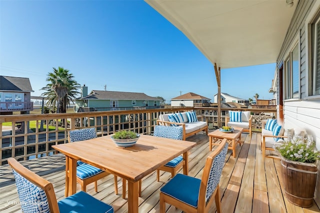 deck featuring outdoor lounge area