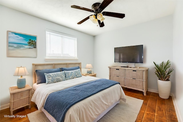 bedroom featuring dark hardwood / wood-style floors and ceiling fan