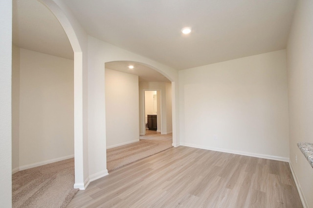 spare room with light wood-type flooring