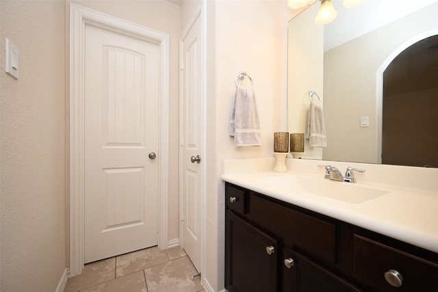 bathroom featuring tile patterned flooring and vanity