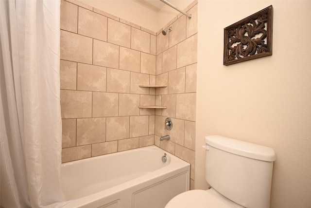 bathroom featuring shower / bath combination with curtain and toilet