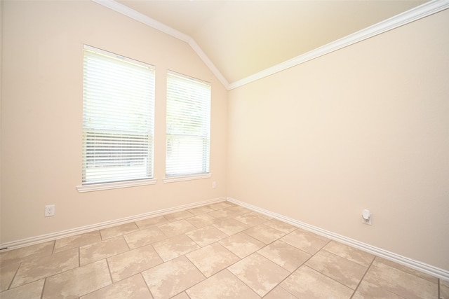 tiled spare room with crown molding and vaulted ceiling