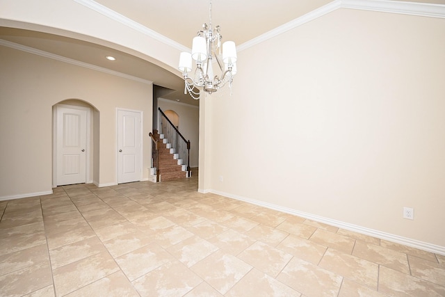 empty room with a chandelier and ornamental molding