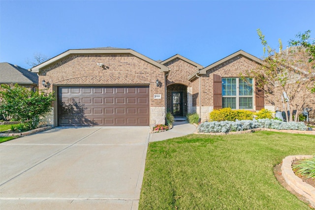 view of front of home with a garage and a front yard