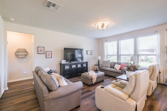 living room with dark hardwood / wood-style flooring