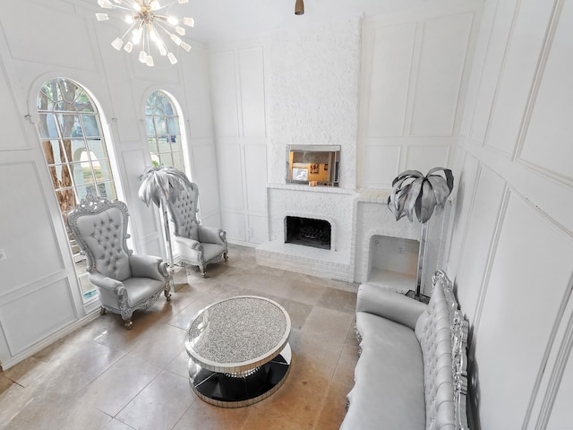 living room with a fireplace and a chandelier