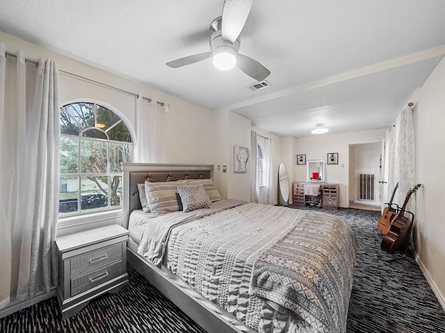 carpeted bedroom featuring ceiling fan