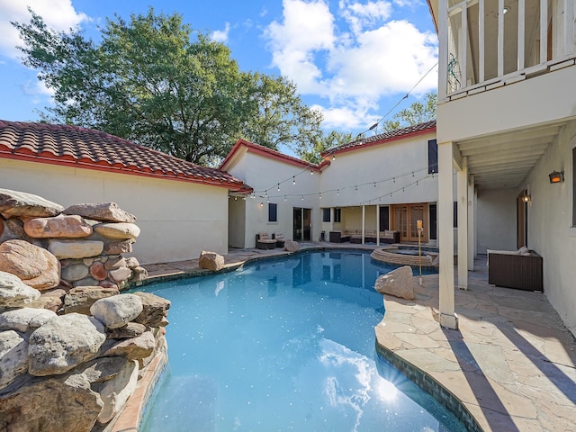 view of swimming pool with a patio