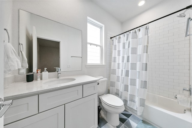 full bathroom featuring toilet, tile patterned floors, vanity, and shower / tub combo with curtain