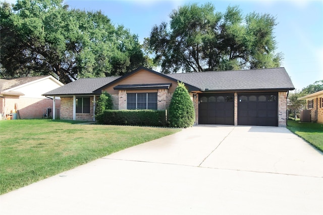 ranch-style home with a front yard and a garage